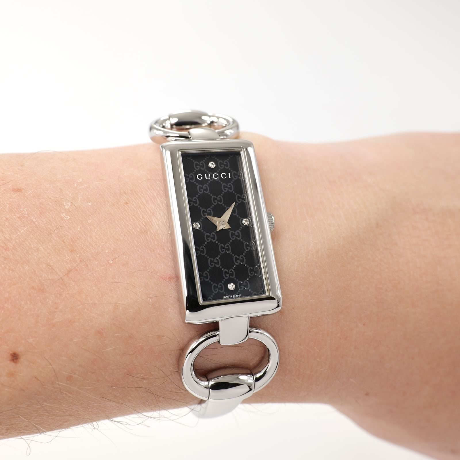 Gucci Tornabuoni 119 Black Dial Bangle watch on the wrist