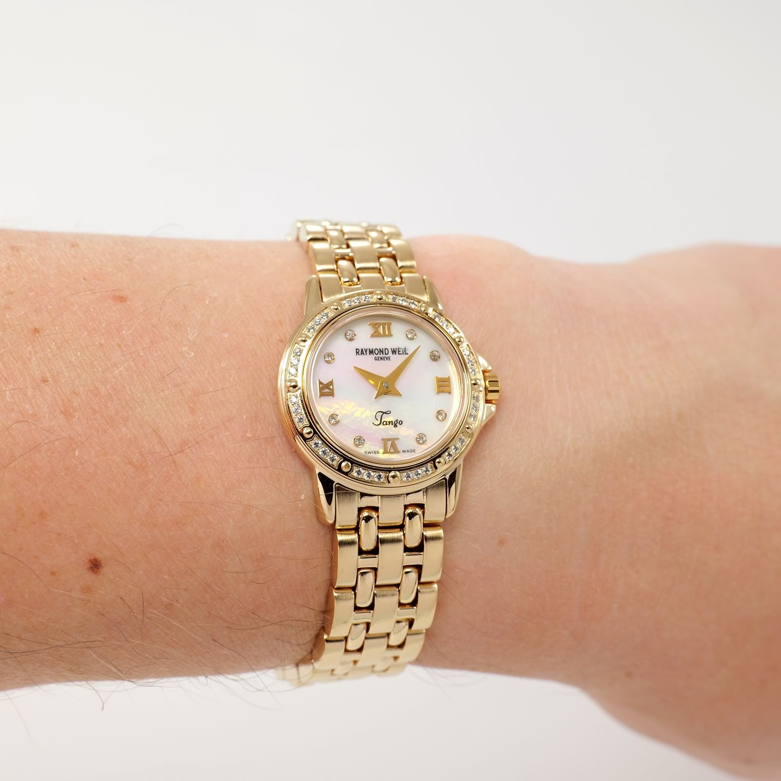 Raymond Weil Tango 5860 White Mother of Pearl 18k Gold Plated on the wrist