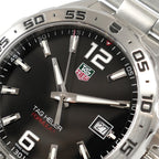TAG Heuer Formula 1 WAZ1112 green and red logo close up