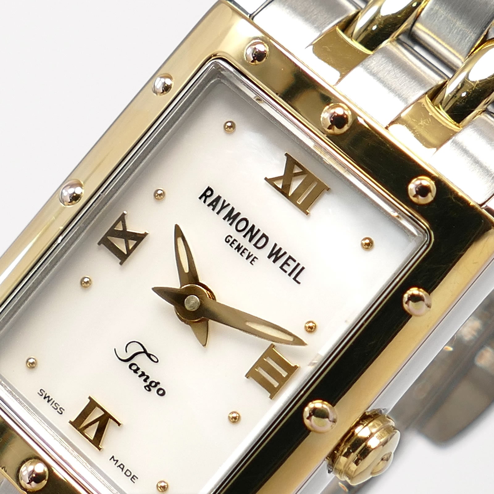 Raymond Weil Tango 5971 logo close up with roman numeral markers