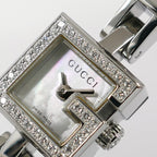 Gucci Mini G 102 logo close up