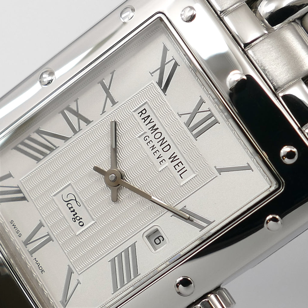 Raymond Weil Tango 5380 guilloche dial logo close up