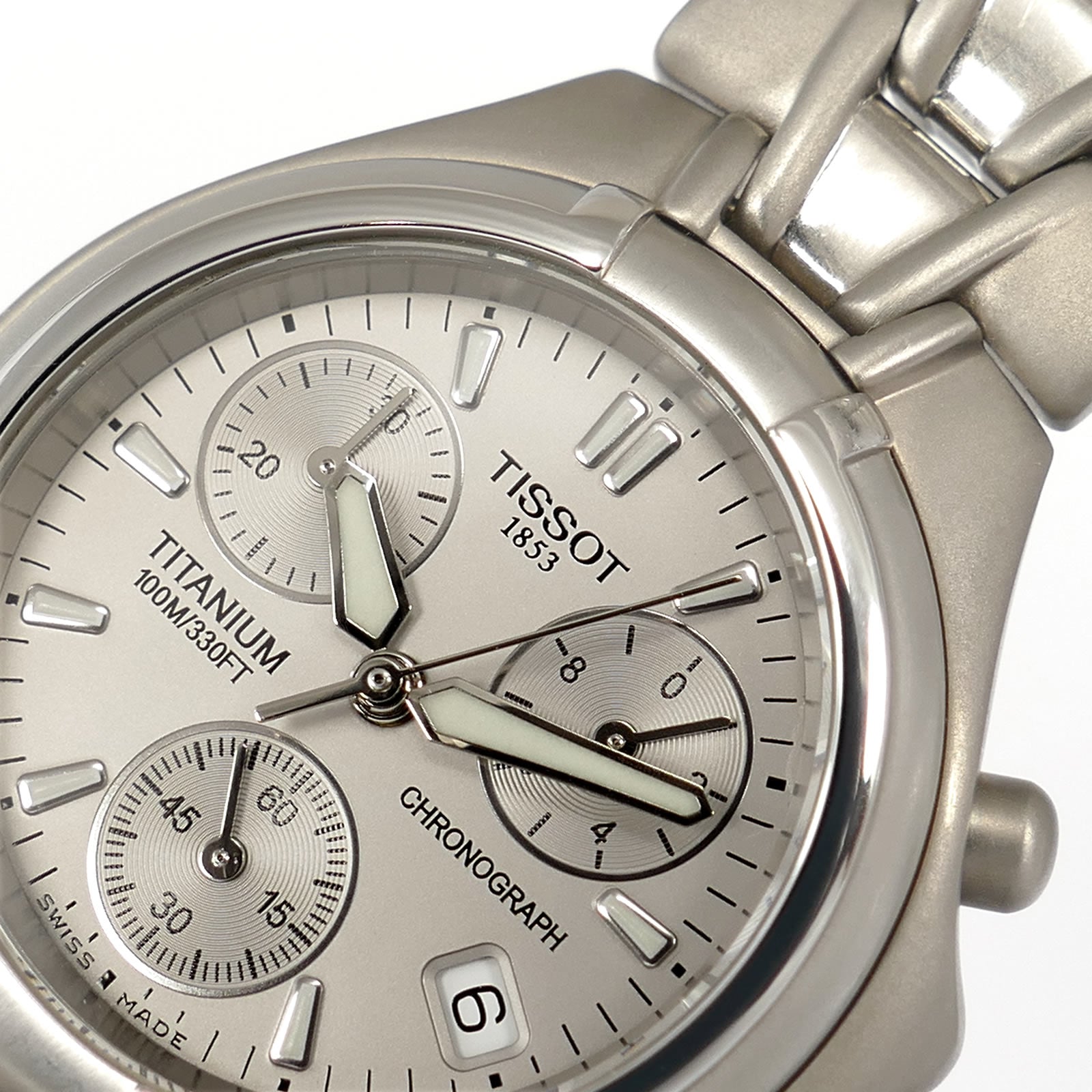Tissot Titanium T645P logo close up