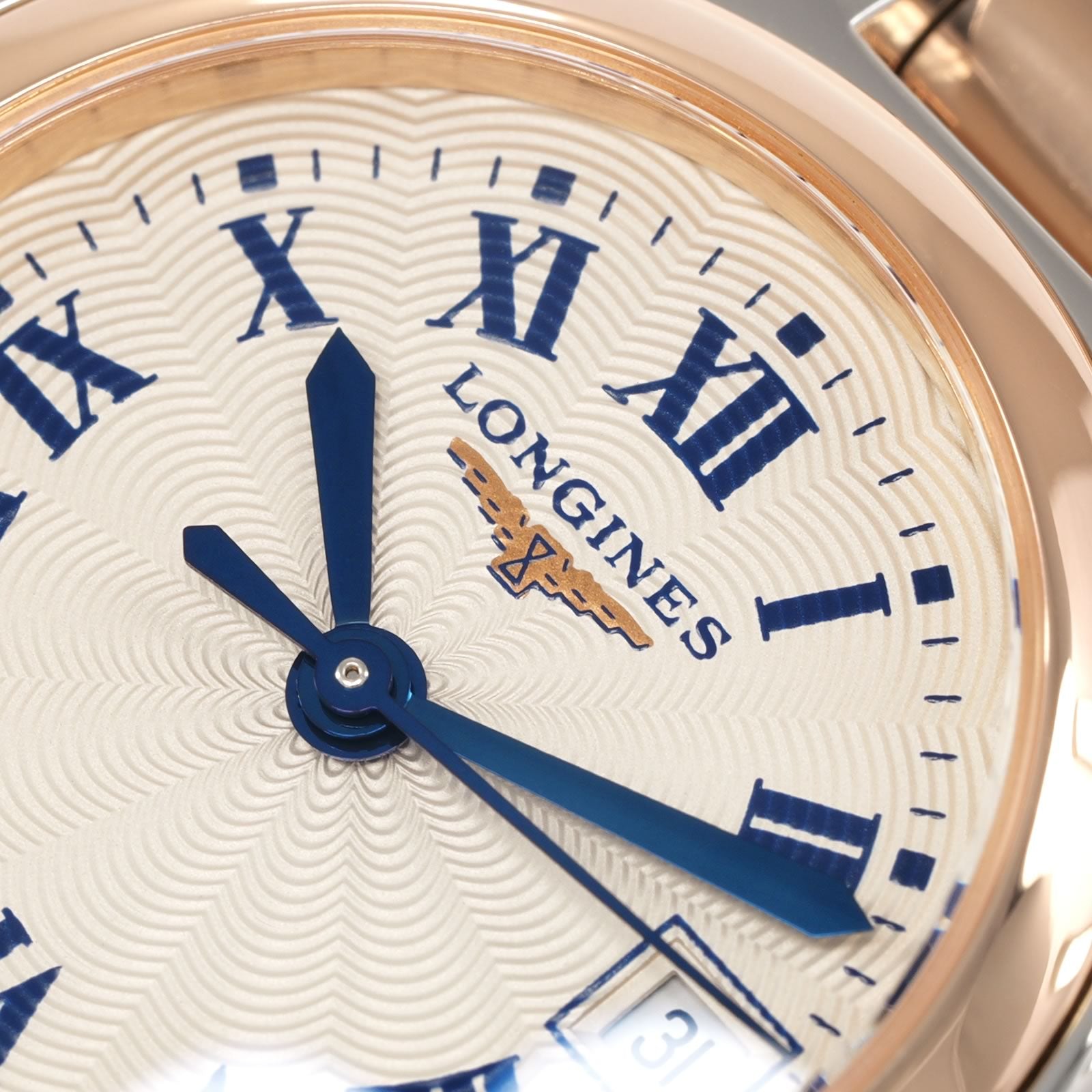 Longines PrimaLuna L8.110.5 logo close up blue hands