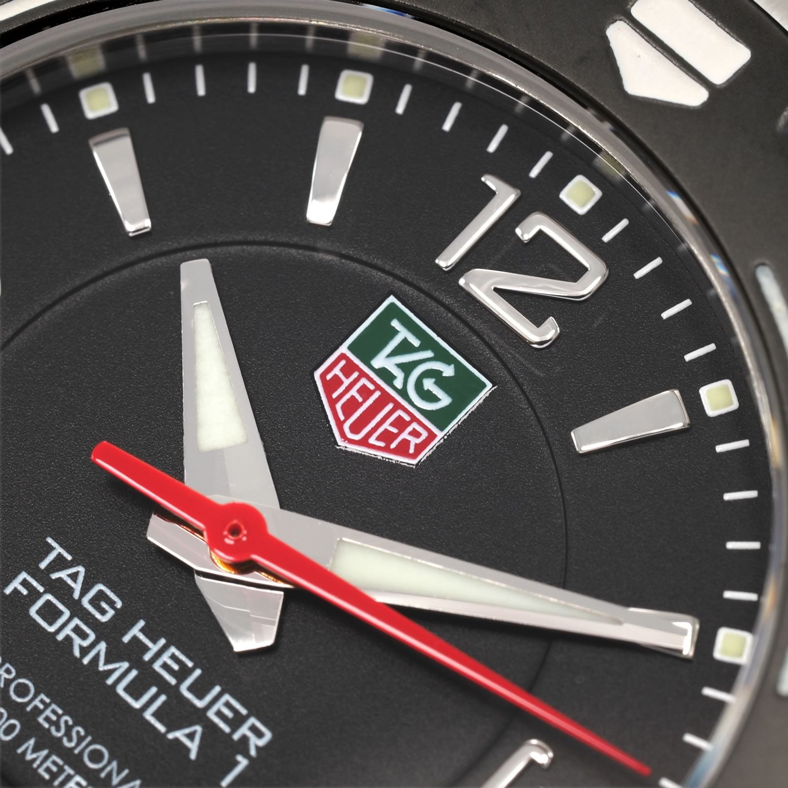 TAG Heuer Formula 1 WAC1210 green and red logo close up