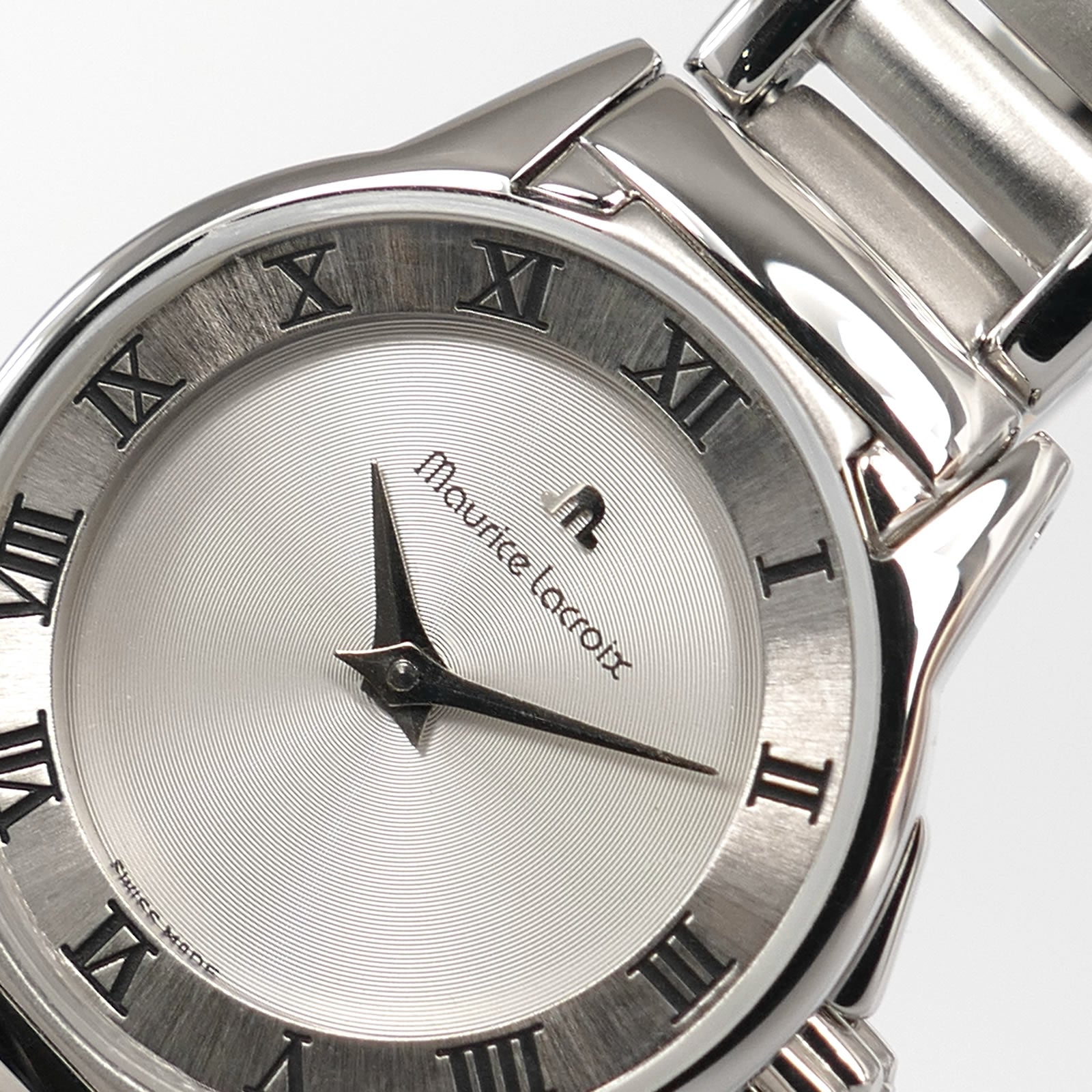 Maurice Lacroix Miros 59749 Silver Circular Grooved Dial and logo close up