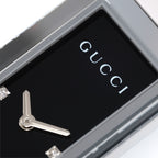 Gucci G-Frame 127.5 logo close up