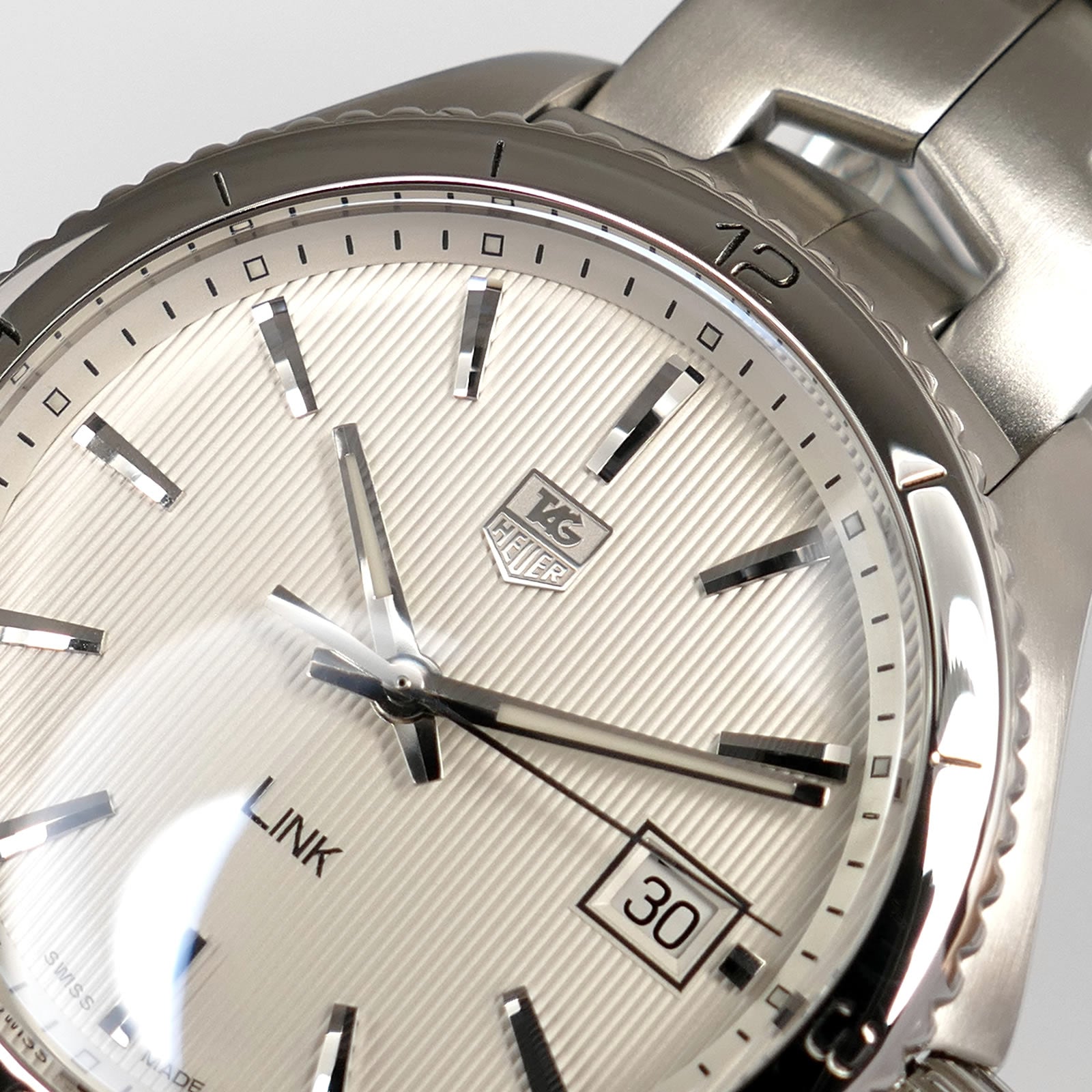 TAG Heuer Link WAT1111 logo close up