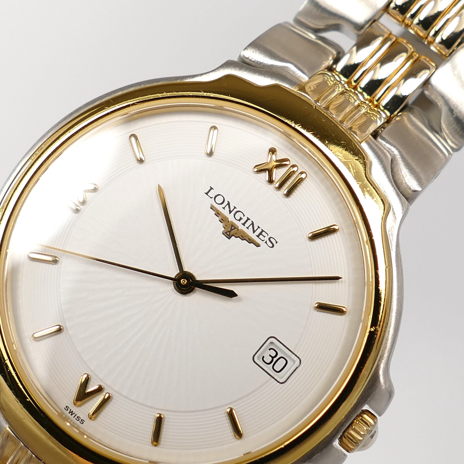 Longines Flagship L5.646.3 guilloche white dial logo close up