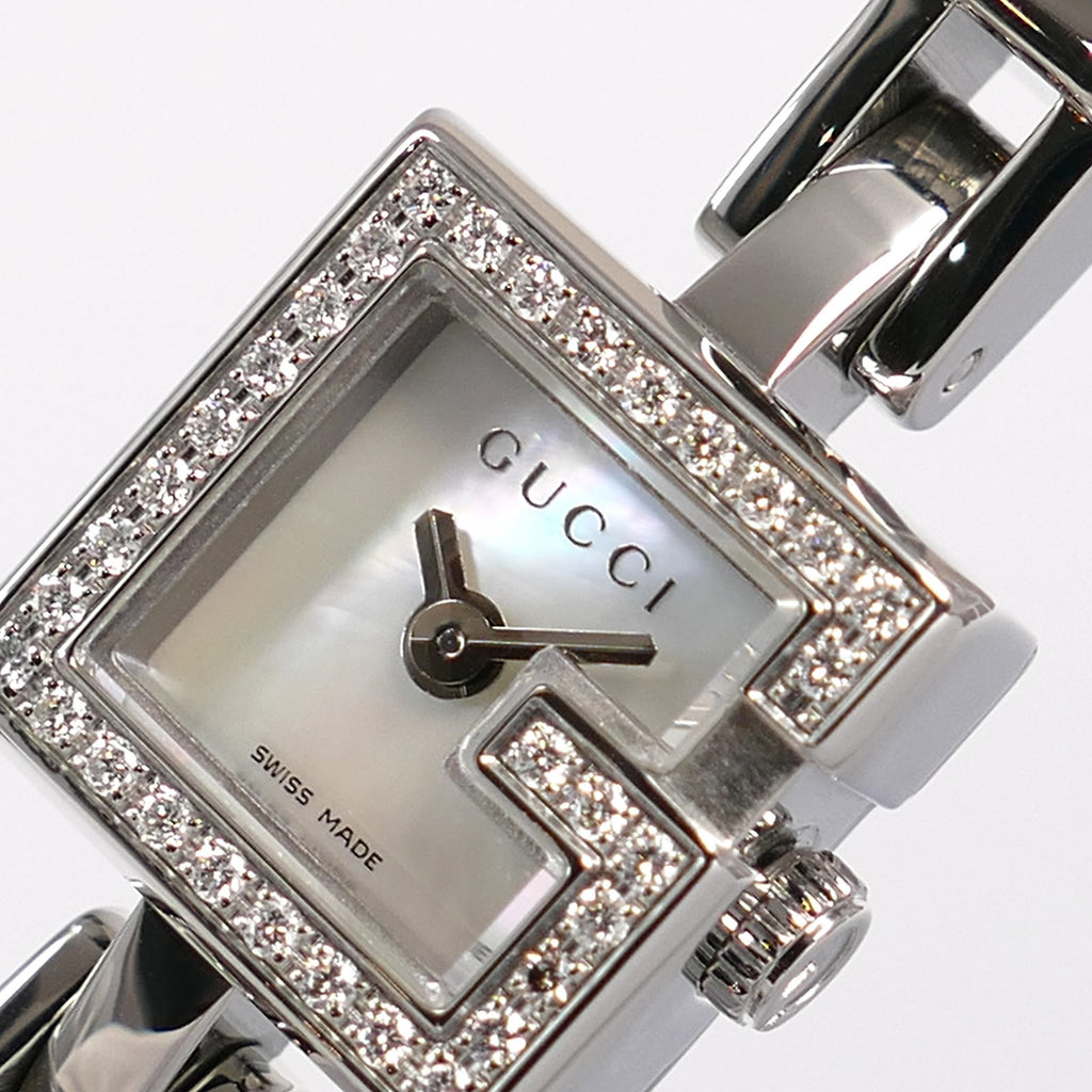 Gucci Mini G 102 logo close up