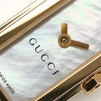 Gucci G-Line 109 logo and iridescent mother of pearl close up