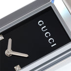 Gucci G-Frame 127.5 logo close up