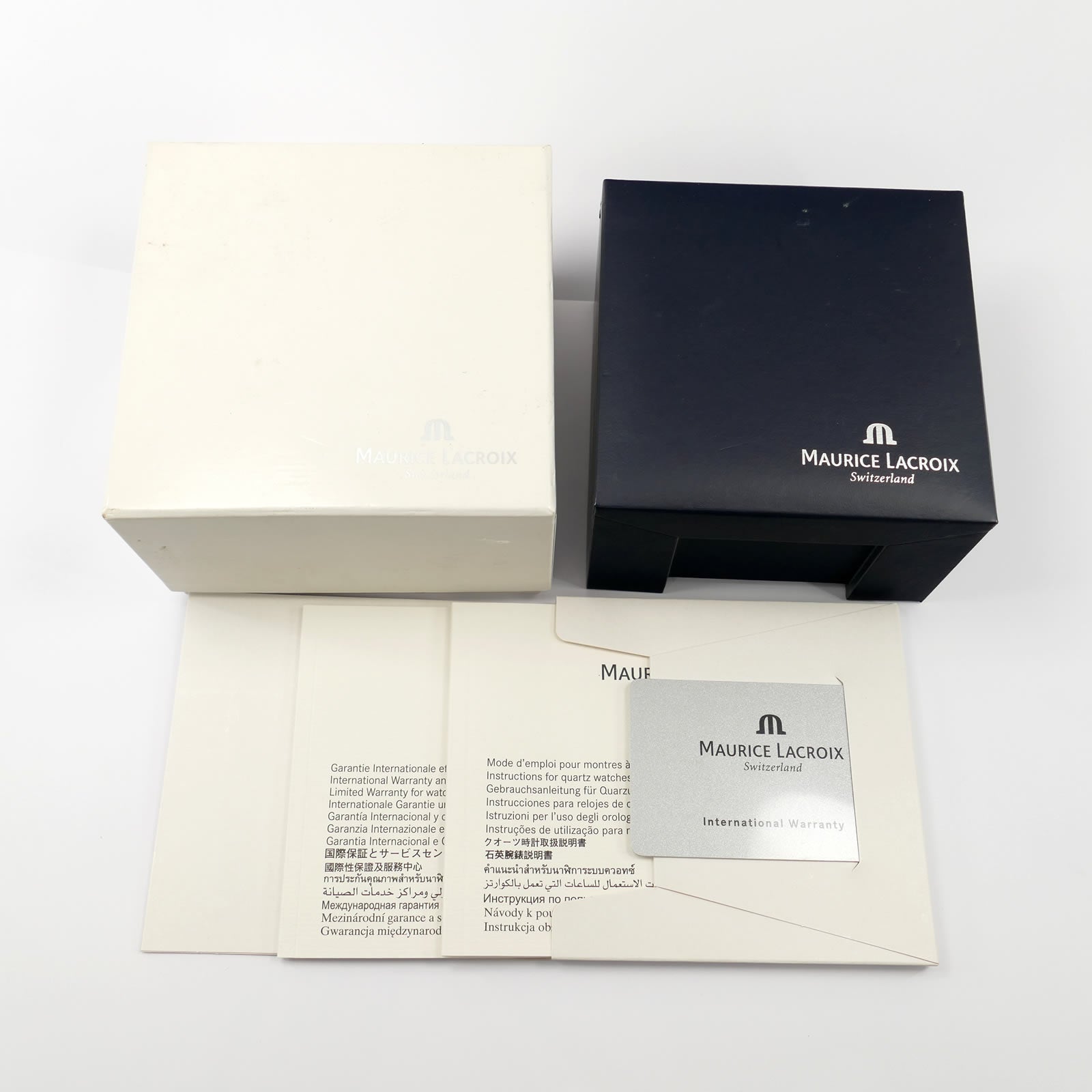 Maurice Lacroix box and papers