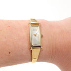 Gucci 1500L White Mother of Pearl 18k Gold Plated Bangle on the wrist