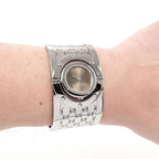 Gucci Twirl 112 Ladies Brown Wide Steel Bangle watch on the wrist