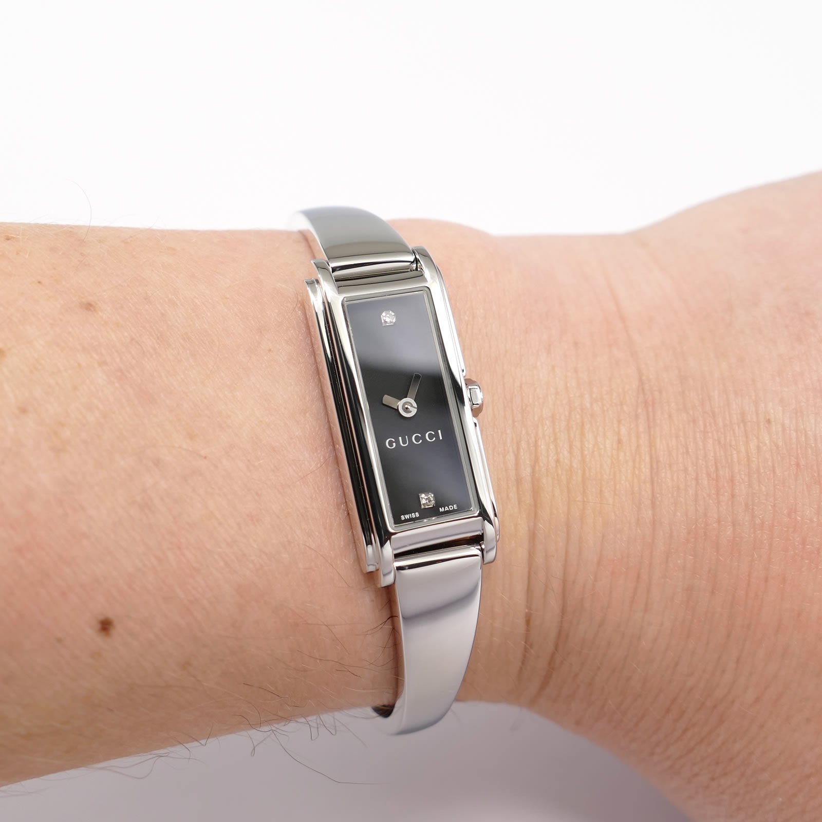 Gucci G-Line 109 Black Rectangular Dial with 2 Diamonds on the wrist bangle watch