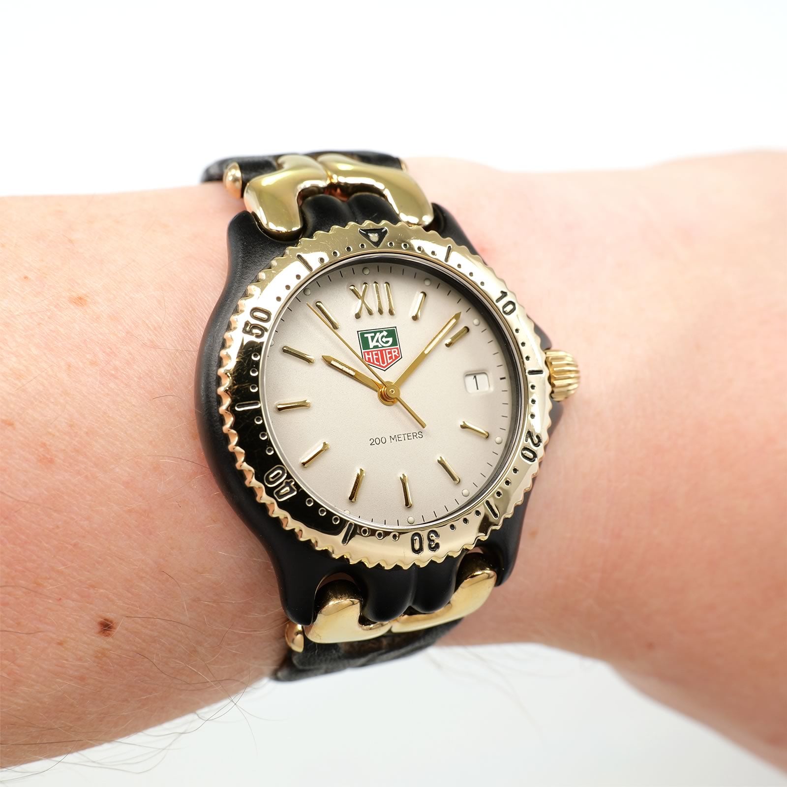 TAG Heuer SEL S93.313C Cream Dial Black PVD and 18k Gold on the wrist