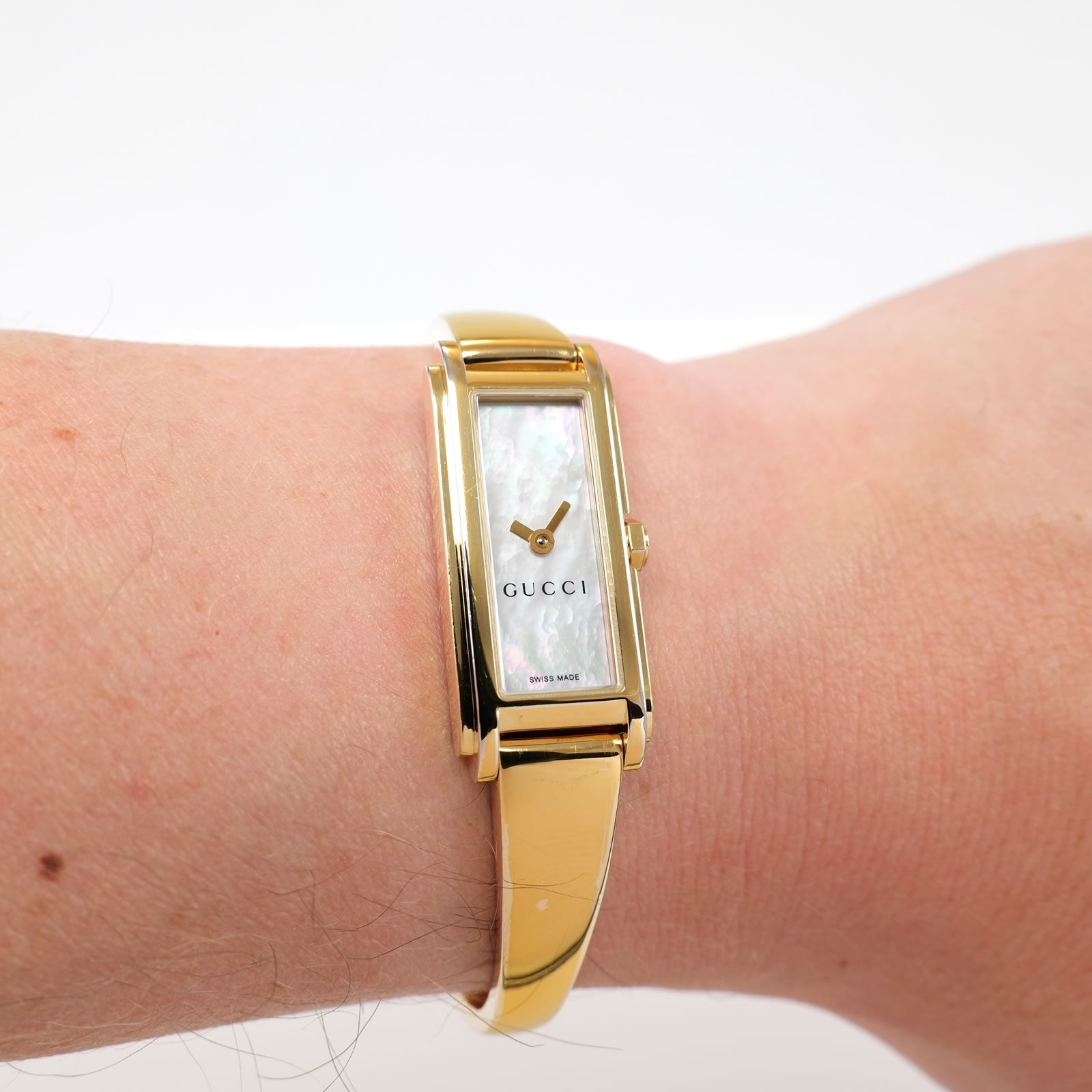 Gucci G-Line 109 White Mother of Pearl Dial 18k Gold Plated on the wrist