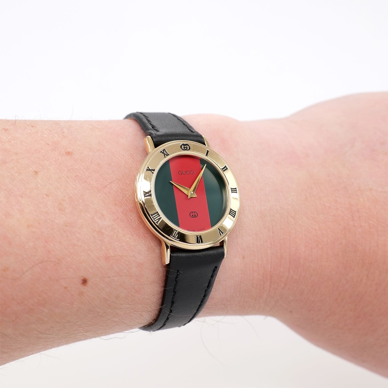 Gucci 3000L Red and Green Dial 18k Gold Plated on the wrist