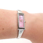 Gucci 1500L Pink Mother of Pearl Bangle watch on the wrist