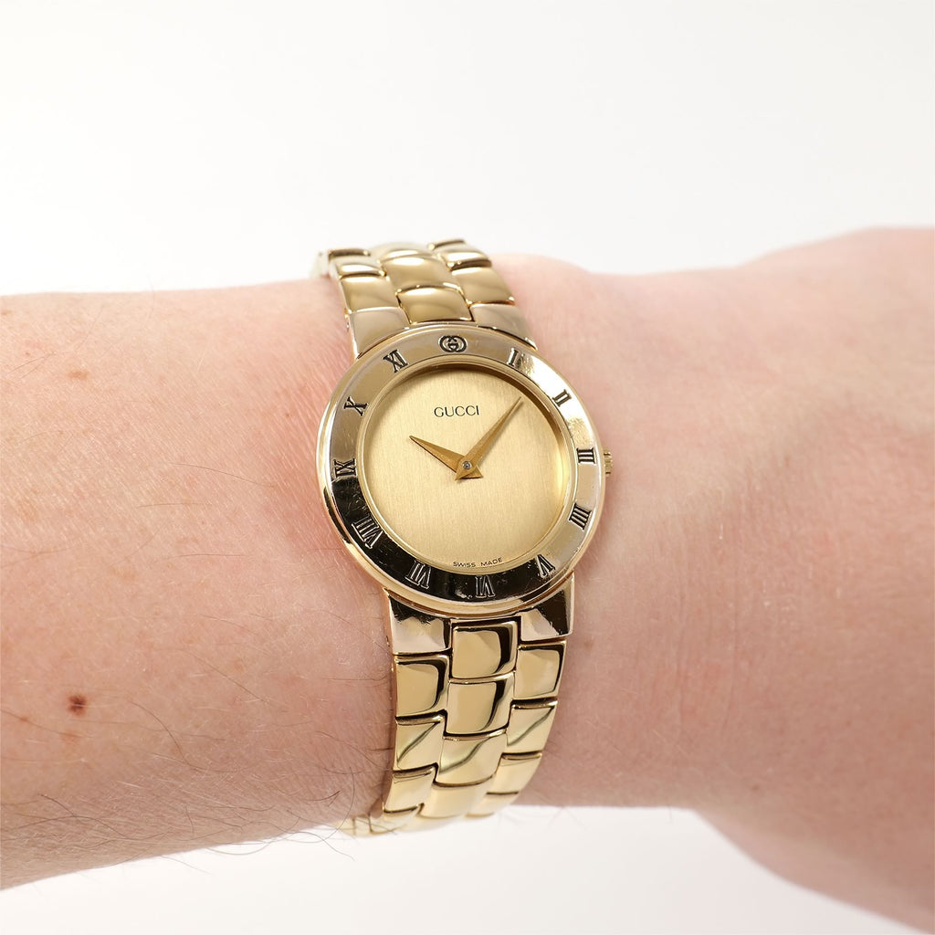 Gucci 3300L Champagne Dial 18k Gold Plated watch on the wrist