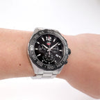 TAG Heuer Formula 1 Chronograph CAZ1010 Men's Black Dial watch on the wrist