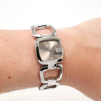 Gucci G 125.5 Brown Sunburst Dial YA125503 on the wrist