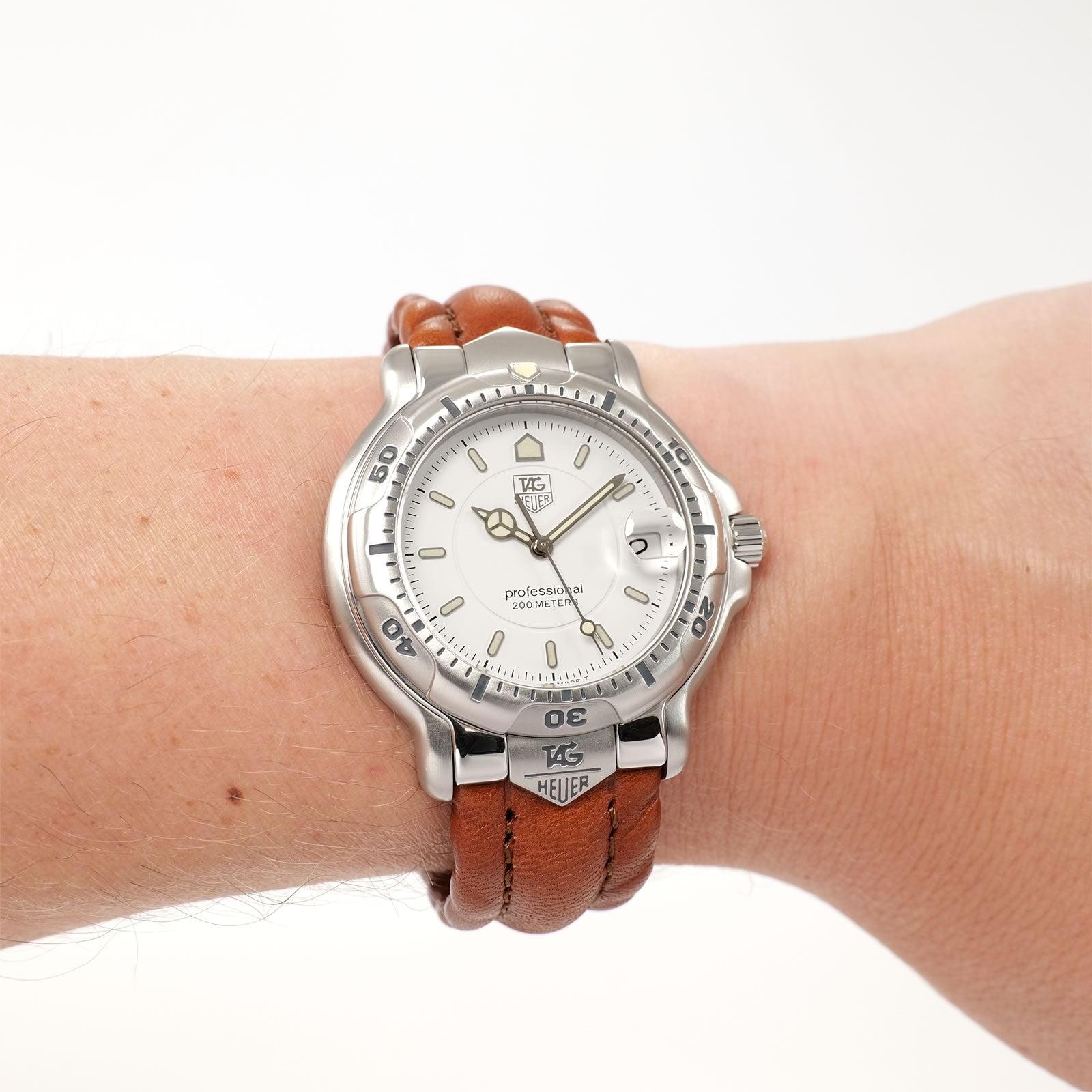 TAG Heuer 6000 WH1111 White Dial on Brown Leather Strap on the wrist