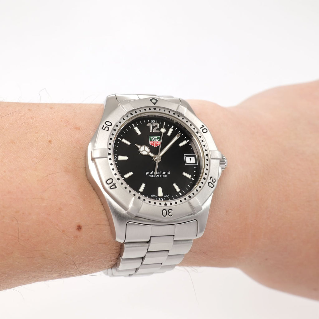 TAG Heuer 2000 WK1110-0 Men's Black Dial watch on the wrist