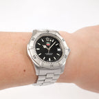 TAG Heuer 2000 WK1110-0 Men's Black Dial watch on the wrist