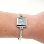 Gucci 1900L Ladies Blue Dial Square Watch on the wrist
