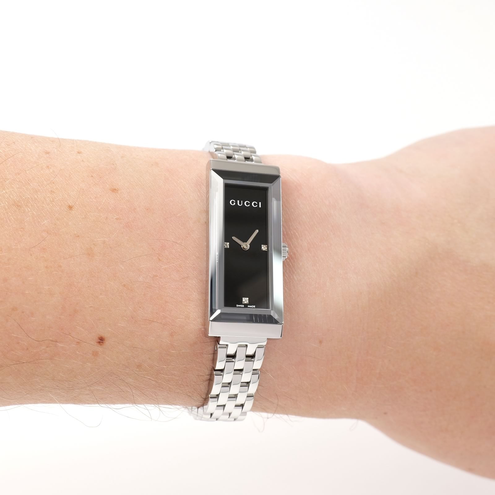 Gucci G-Frame 127.5 Ladies Black dial watch on the wrist