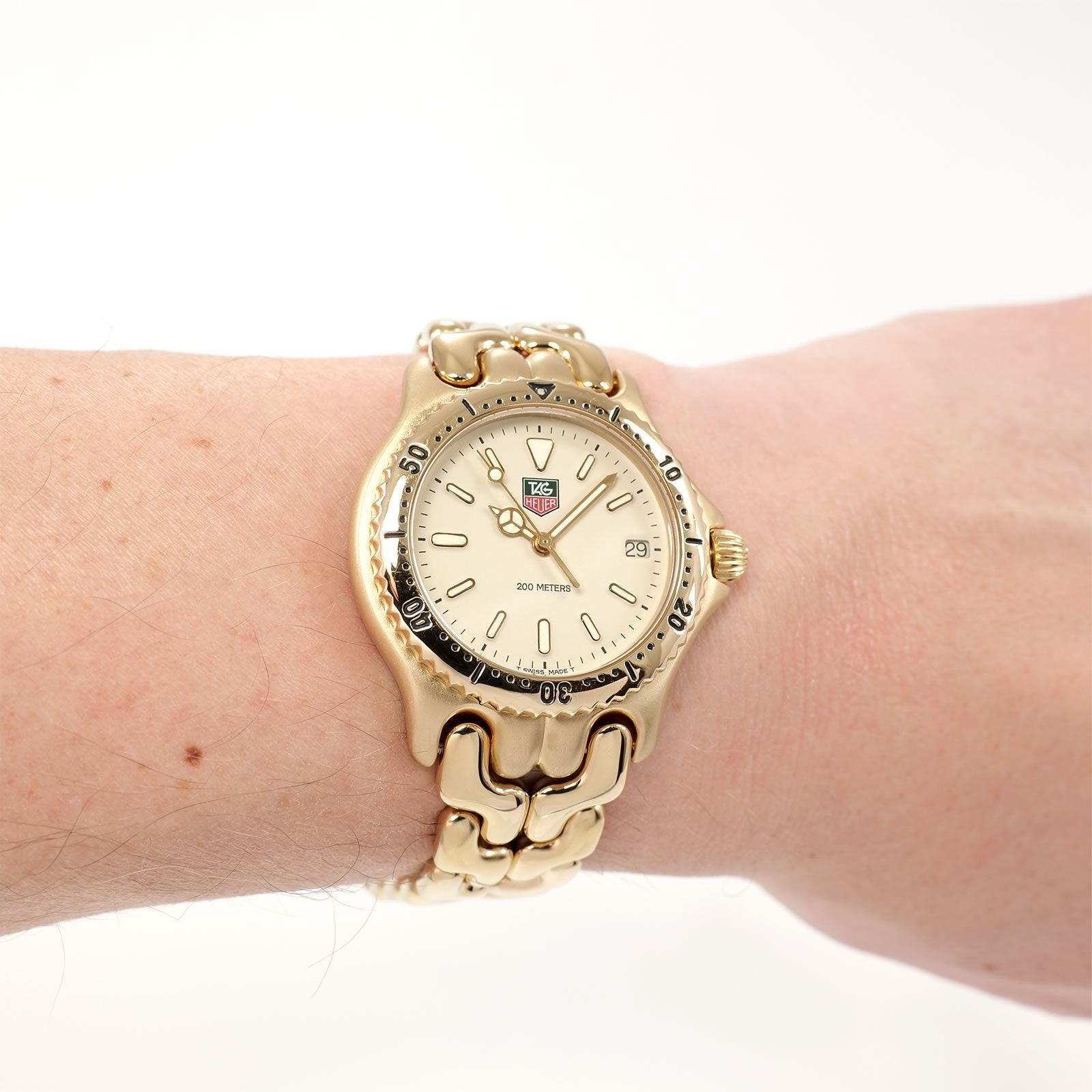 TAG Heuer SEL S94.713M/E Cream Dial 18k Gold Plated watch on the wrist