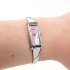 Gucci 1500L Pink Mother of Pearl ladies bangle watch on the wrist