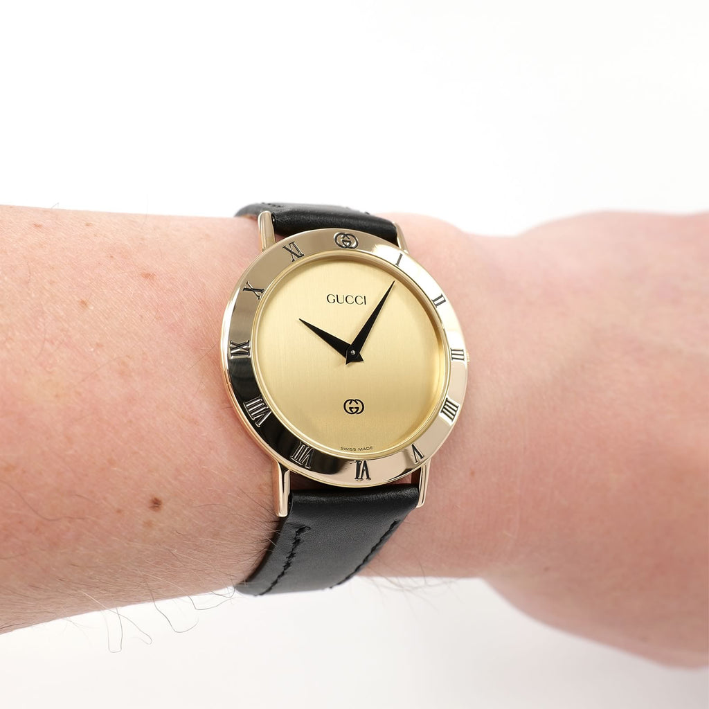 Gucci 3000M Champagne Dial gold watch on the wrist