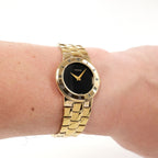 Gucci 3300L Ladies Black Dial 18k Gold Plated watch on the wrist