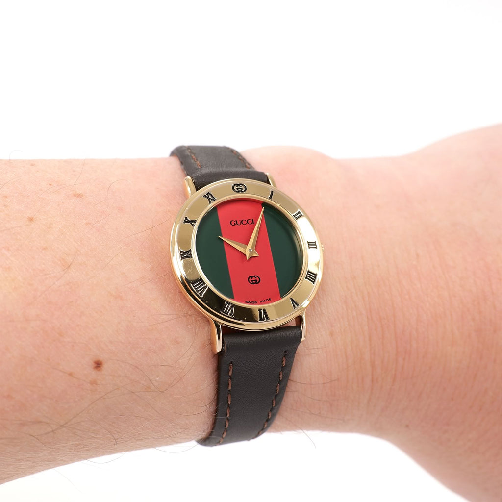 Gucci 3000L Red and Green Dial 18k Gold Plated watch on the wrist