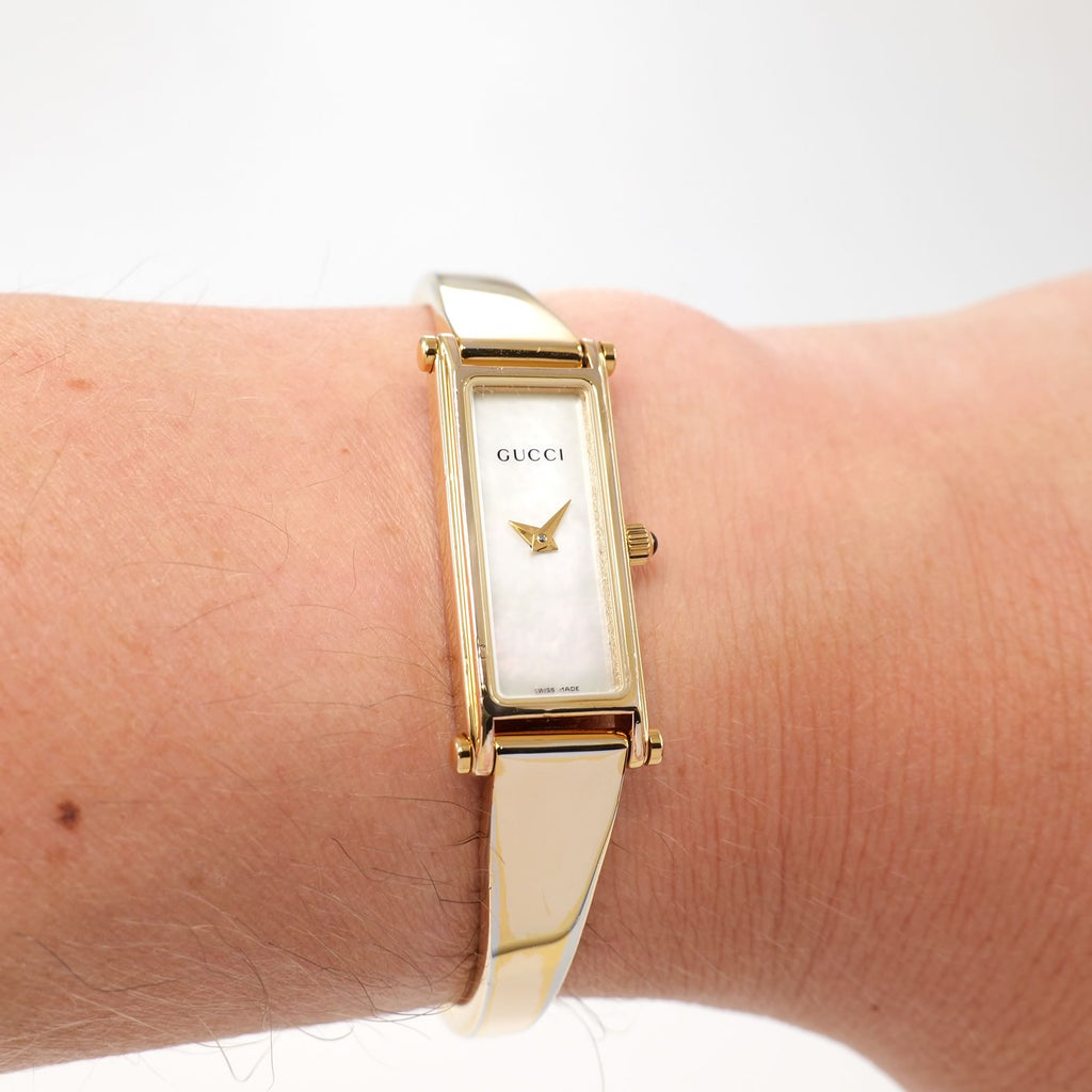 Gucci 1500L Ladies White Mother of Pearl 18k Gold Plated watch on the wrist