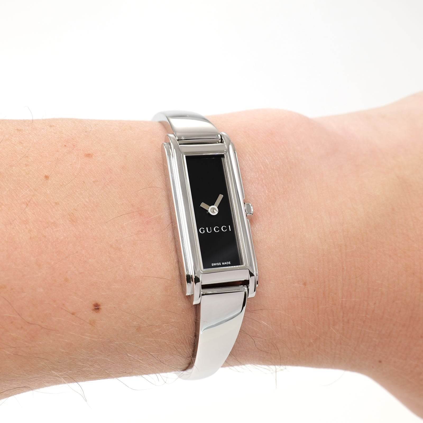 Gucci G-Line 109 Ladies Black Dial Bangle Watch on the wrist