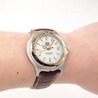 TAG Heuer SEL WI1150 White Dial 18k Gold Bezel watch on the wrist