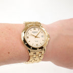 Raymond Weil Tango 5560 Men's Cream Dial 18k Gold Plated watch on the wrist