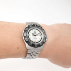 TAG Heuer Formula 1 WA1218 Men's White and Black Mid Size watch on the wrist
