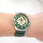 TAG Heuer Formula 1 WA1212 Luminous Green Dial Unisex watch on the wrist