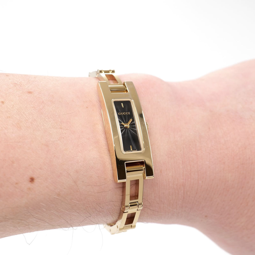 Gucci 3900L Black Guilloche Dial Gold Rectangular watch on the wrist
