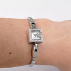 Gucci Mini G 102 White Mother of Pearl on the wrist