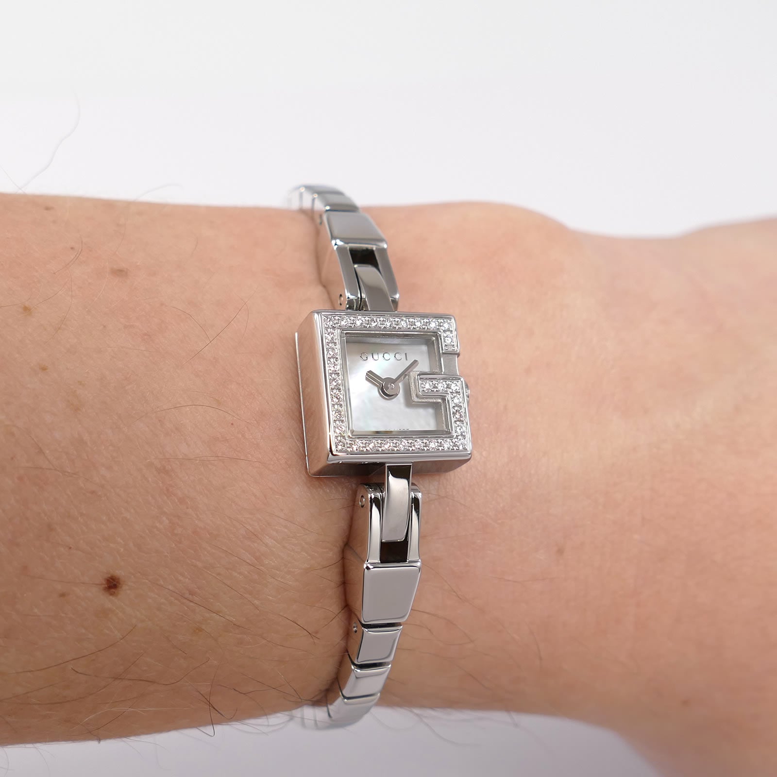 Gucci Mini G 102 White Mother of Pearl on the wrist