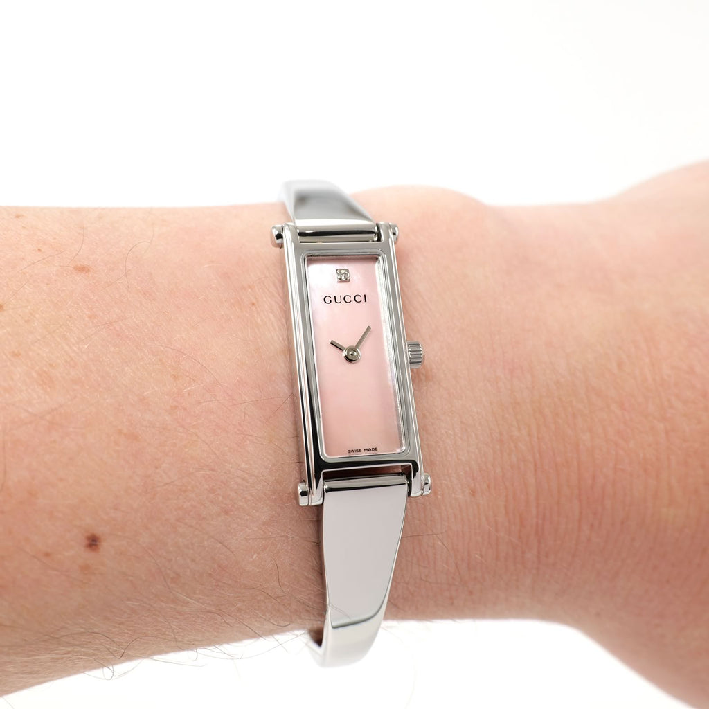 Gucci 1500L Pink Mother of Pearl Bangle watch on the wrist