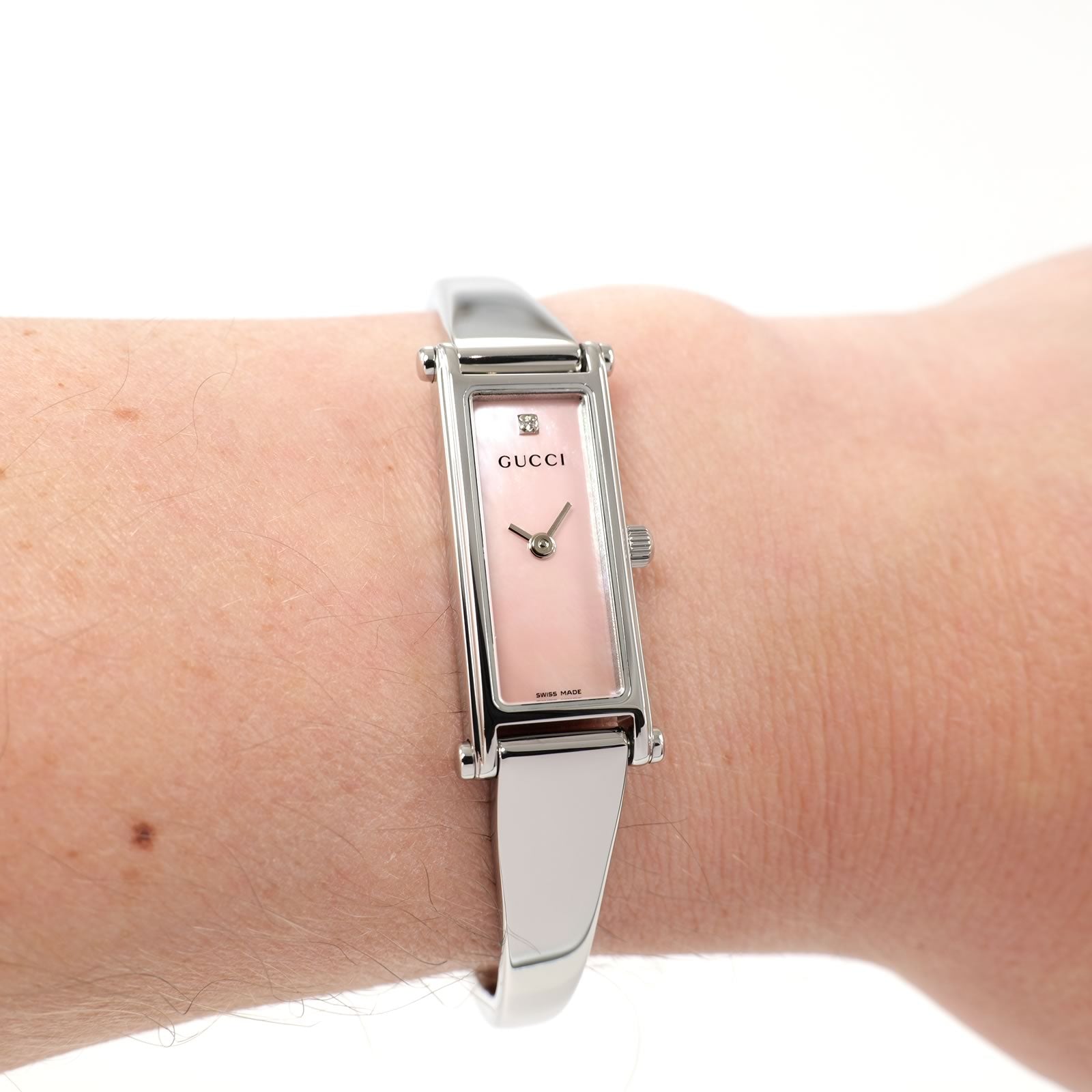 Gucci 1500L Pink Mother of Pearl Bangle watch on the wrist