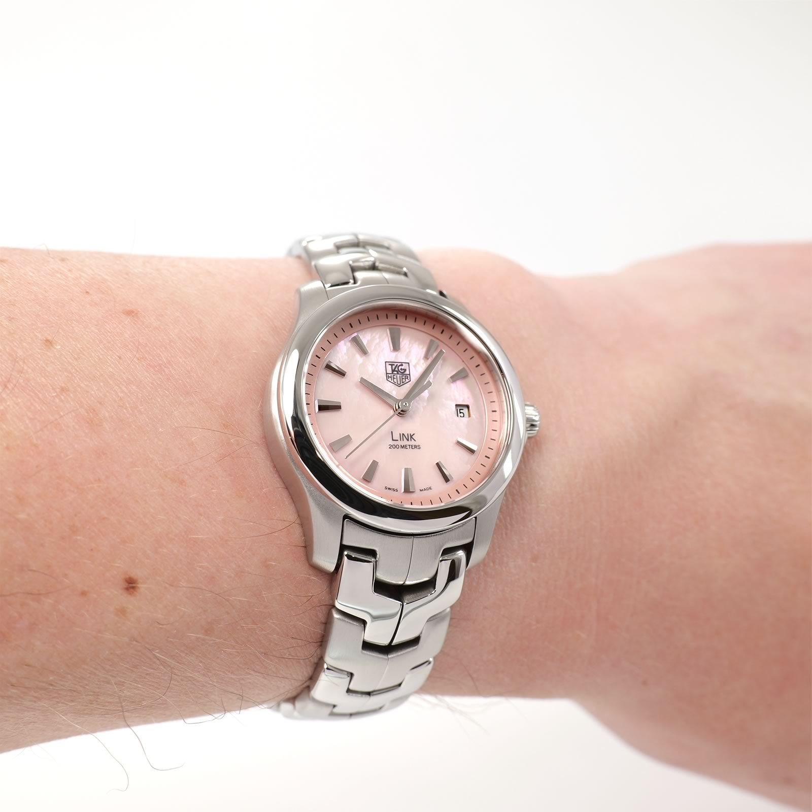 TAG Heuer Link WJF1312 Ladies Pink Mother of Pearl watch on the wrist