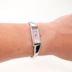 Gucci 1500L Ladies Pink Mother of Pearl Rectangular watch on the wrist